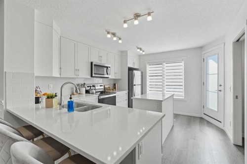 102-474 Seton Circle Se, Calgary, AB - Indoor Photo Showing Kitchen With Upgraded Kitchen