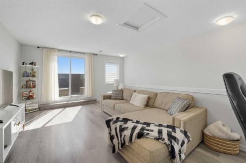 102-474 Seton Circle Se, Calgary, AB - Indoor Photo Showing Living Room