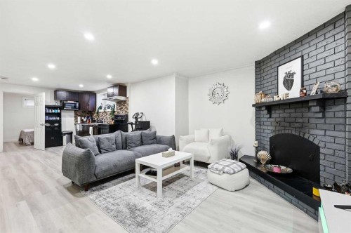 419 Whiteview Close Ne, Calgary, AB - Indoor Photo Showing Living Room With Fireplace