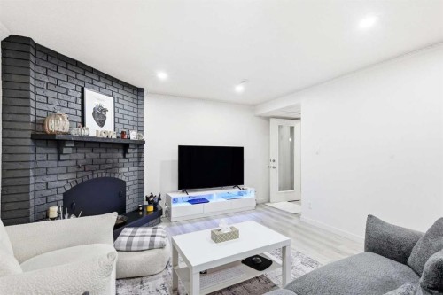 419 Whiteview Close Ne, Calgary, AB - Indoor Photo Showing Living Room With Fireplace