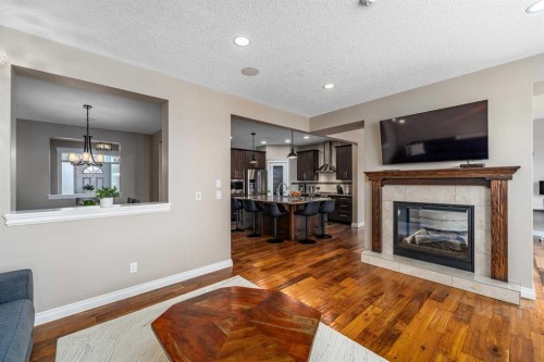 151 Auburn Sound Circle Se, Calgary, AB - Indoor Photo Showing Living Room With Fireplace
