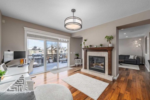 151 Auburn Sound Circle Se, Calgary, AB - Indoor Photo Showing Living Room With Fireplace