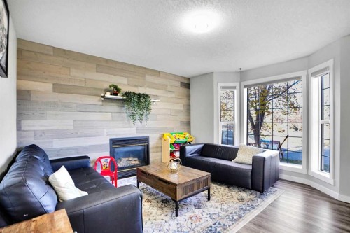 5 Coville Gardens Ne, Calgary, AB - Indoor Photo Showing Living Room With Fireplace