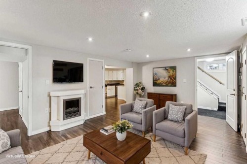 439 Hendon Drive Nw, Calgary, AB - Indoor Photo Showing Living Room With Fireplace