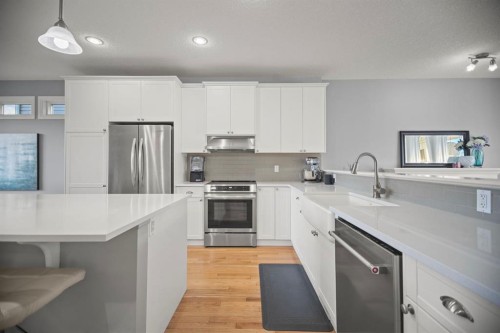 411 River Heights Crescent, Cochrane, AB - Indoor Photo Showing Kitchen With Upgraded Kitchen