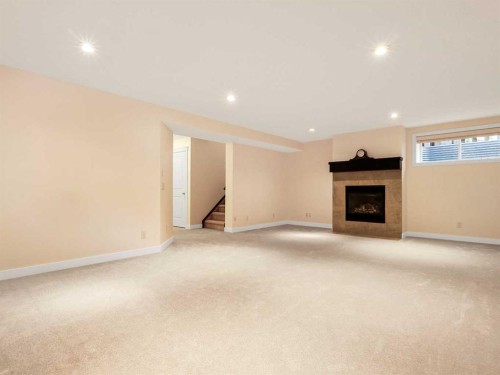 50 Elgin Meadows Green Se, Calgary, AB - Indoor With Fireplace