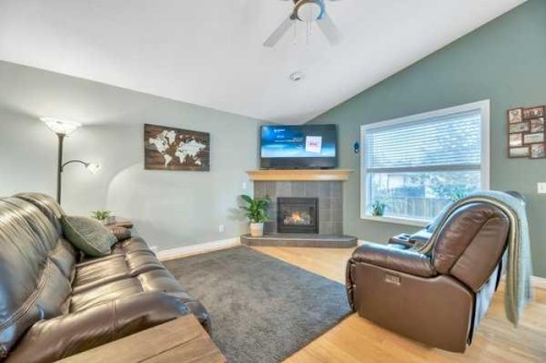 196 Camden Place, Strathmore, AB - Indoor Photo Showing Living Room With Fireplace