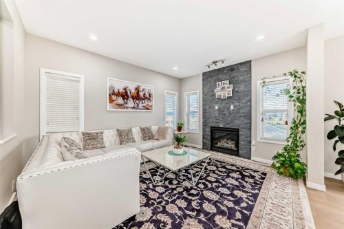 28 Panton Court Nw, Calgary, AB - Indoor Photo Showing Living Room With Fireplace