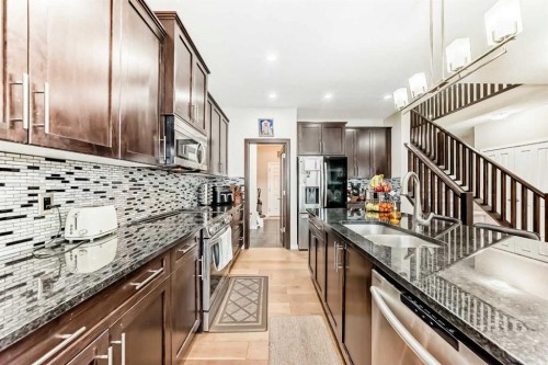 28 Panton Court Nw, Calgary, AB - Indoor Photo Showing Kitchen With Stainless Steel Kitchen With Double Sink With Upgraded Kitchen