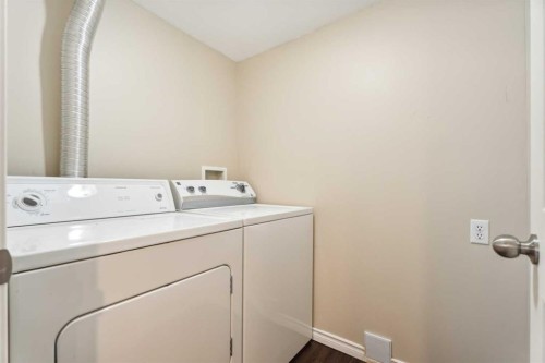 73 Rocky Ridge Heath Nw, Calgary, AB - Indoor Photo Showing Laundry Room