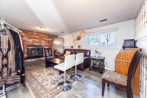 304 Whitefield Drive Ne, Calgary, AB - Indoor With Fireplace