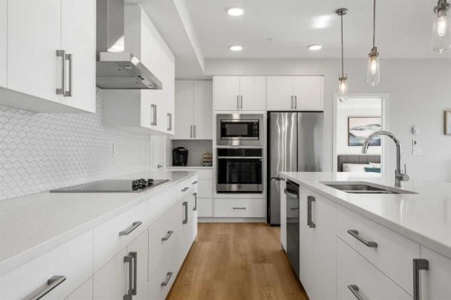 4113-550 Belmont Street, Calgary, AB - Indoor Photo Showing Kitchen With Stainless Steel Kitchen With Double Sink With Upgraded Kitchen