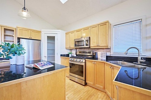 250 Strathridge Place Sw, Calgary, AB - Indoor Photo Showing Kitchen With Double Sink
