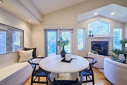 250 Strathridge Place Sw, Calgary, AB - Indoor Photo Showing Living Room With Fireplace