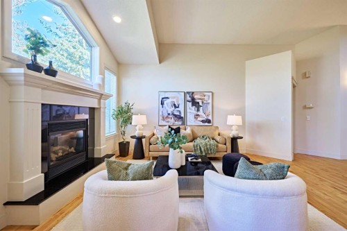 250 Strathridge Place Sw, Calgary, AB - Indoor Photo Showing Living Room With Fireplace