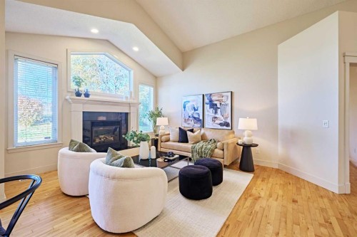 250 Strathridge Place Sw, Calgary, AB - Indoor Photo Showing Living Room With Fireplace