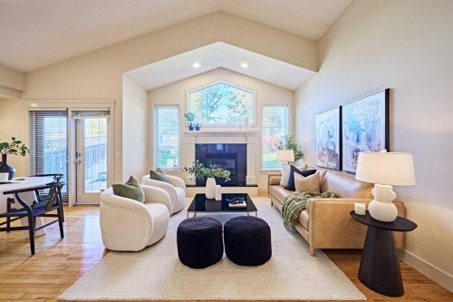 250 Strathridge Place Sw, Calgary, AB - Indoor Photo Showing Living Room With Fireplace