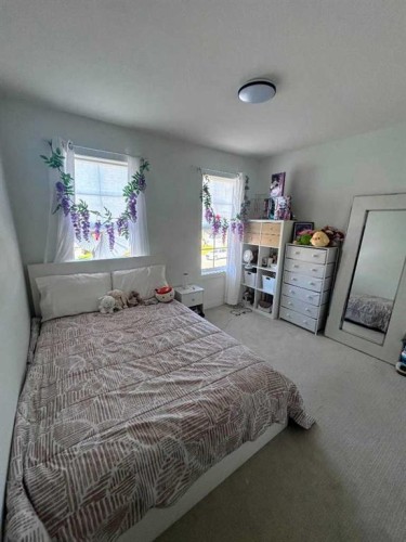217 Dawson Way, Chestermere, AB - Indoor Photo Showing Bedroom
