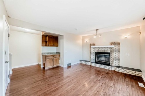 2740 Signal Hill Drive Sw, Calgary, AB - Indoor Photo Showing Living Room With Fireplace