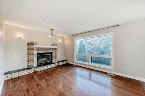 2740 Signal Hill Drive Sw, Calgary, AB - Indoor Photo Showing Living Room With Fireplace