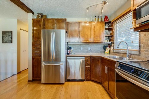 150 Midcrest Crescent Se, Calgary, AB - Indoor Photo Showing Kitchen With Stainless Steel Kitchen With Double Sink