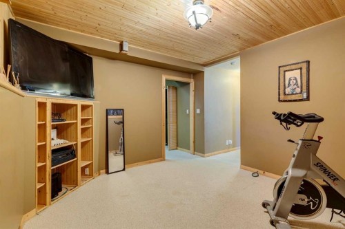 150 Midcrest Crescent Se, Calgary, AB - Indoor Photo Showing Gym Room