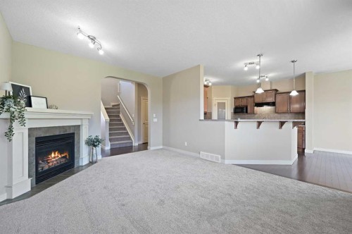 229 Bridlerange Place Sw, Calgary, AB - Indoor With Fireplace
