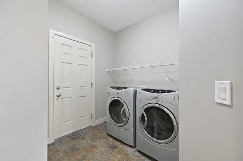 229 Bridlerange Place Sw, Calgary, AB - Indoor Photo Showing Laundry Room