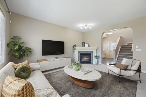 229 Bridlerange Place Sw, Calgary, AB - Indoor Photo Showing Living Room With Fireplace