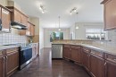 229 Bridlerange Place Sw, Calgary, AB  - Indoor Photo Showing Kitchen With Upgraded Kitchen 