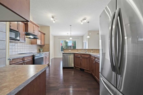 229 Bridlerange Place Sw, Calgary, AB - Indoor Photo Showing Kitchen With Upgraded Kitchen