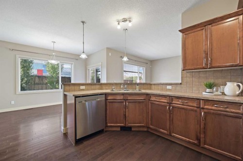 229 Bridlerange Place Sw, Calgary, AB - Indoor Photo Showing Kitchen With Double Sink