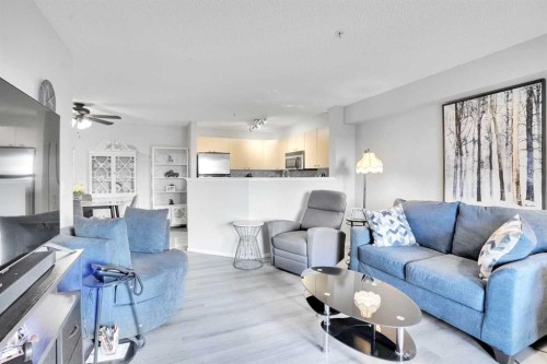 6211-304 Mackenzie Way Sw, Airdrie, AB - Indoor Photo Showing Living Room