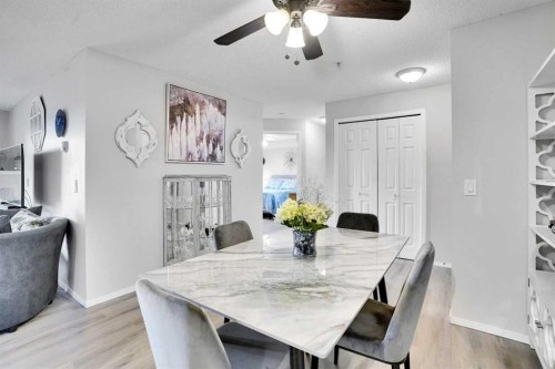 6211-304 Mackenzie Way Sw, Airdrie, AB - Indoor Photo Showing Dining Room