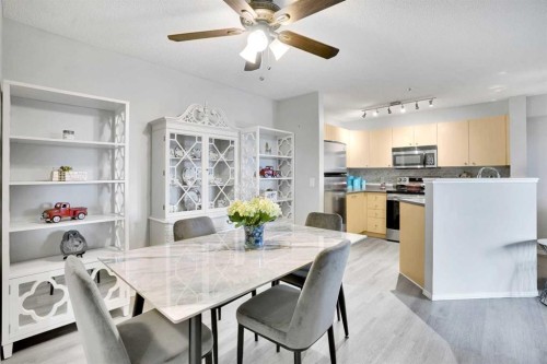6211-304 Mackenzie Way Sw, Airdrie, AB - Indoor Photo Showing Dining Room