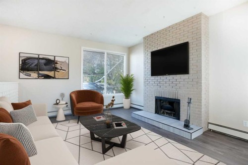 4004 79 Street Nw, Calgary, AB - Indoor Photo Showing Living Room With Fireplace