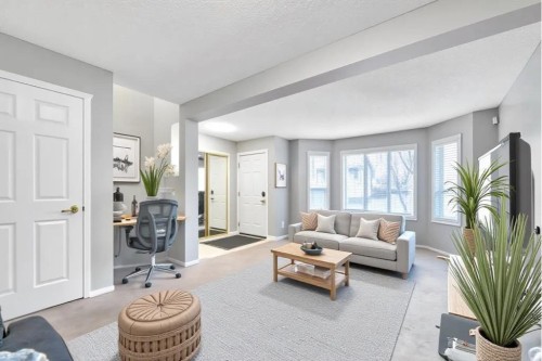 17 Taravista Way Ne, Calgary, AB - Indoor Photo Showing Living Room