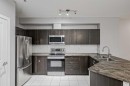 303-100 Cranfield Common Se, Calgary, AB  - Indoor Photo Showing Kitchen With Double Sink With Upgraded Kitchen 