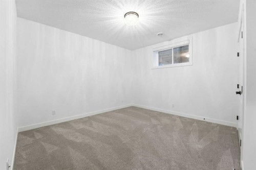 65 Rowmont Link Nw, Calgary, AB - Indoor Photo Showing Other Room