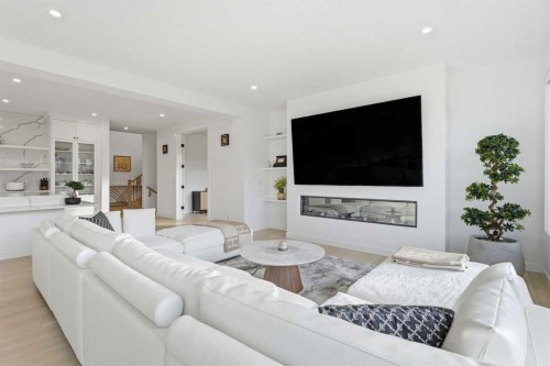 65 Rowmont Link Nw, Calgary, AB - Indoor Photo Showing Living Room With Fireplace