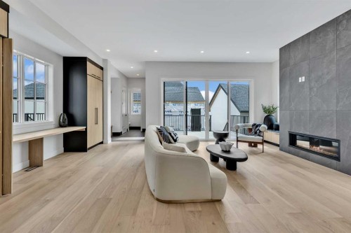 330 Normandy Drive Sw, Calgary, AB - Indoor With Fireplace