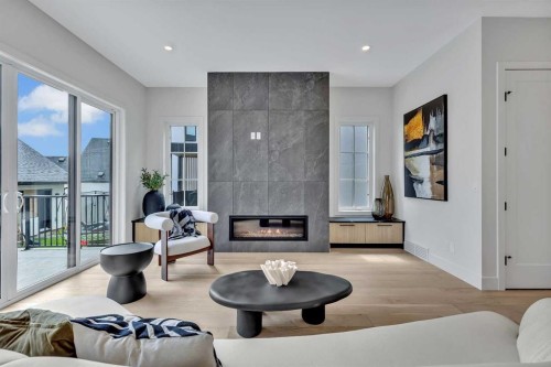 330 Normandy Drive Sw, Calgary, AB - Indoor Photo Showing Living Room With Fireplace