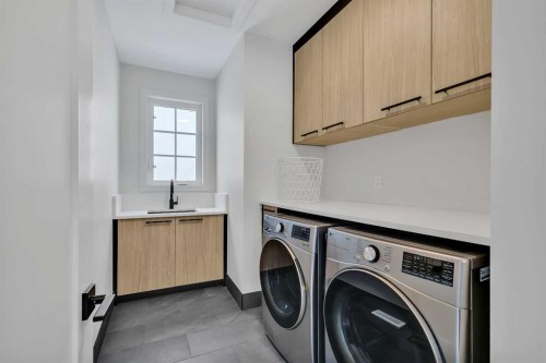 330 Normandy Drive Sw, Calgary, AB - Indoor Photo Showing Laundry Room