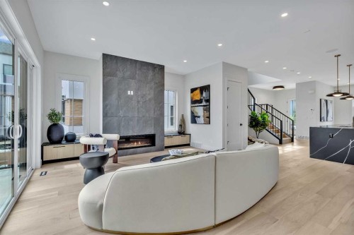 330 Normandy Drive Sw, Calgary, AB - Indoor Photo Showing Living Room With Fireplace
