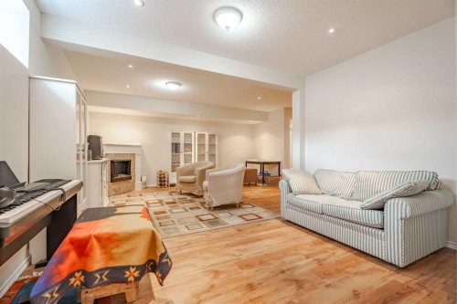 41 Everridge Court Sw, Calgary, AB - Indoor Photo Showing Living Room With Fireplace
