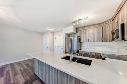 2425-6118 80 Avenue Ne, Calgary, AB - Indoor Photo Showing Kitchen With Stainless Steel Kitchen With Double Sink With Upgraded Kitchen