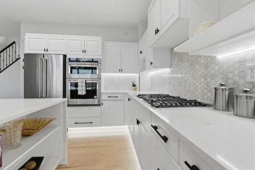 146 Springbluff Heights Sw, Calgary, AB - Indoor Photo Showing Kitchen With Stainless Steel Kitchen With Upgraded Kitchen