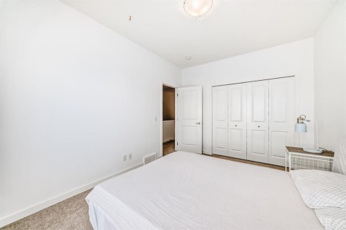 802-250 Fireside View, Cochrane, AB - Indoor Photo Showing Bedroom