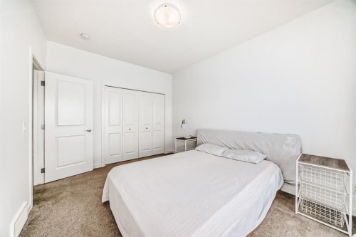 802-250 Fireside View, Cochrane, AB - Indoor Photo Showing Bedroom