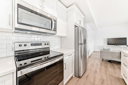 802-250 Fireside View, Cochrane, AB - Indoor Photo Showing Kitchen With Stainless Steel Kitchen